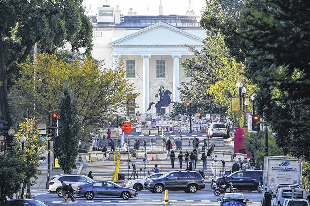 125788325_web1_APrelieftalks
AP Photo | J. Scott Applewhite
The White House is seen in Washington, early Tuesday, Oct. 6, 2020, the morning after President Donald Trump returned from the hospital where he was treated for COVID-19. Traffic moves along K Street NW as TV crews set up in Black Lives Matter Plaza.