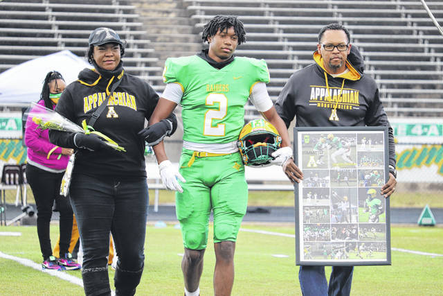 126807019_web1_DaltonStroman1
Senior Dalton Stroman Jr. and his parents Janet and Dalton Sr., walk across the field at Raider Stadium during the teams Senior Day ceremony.
Neel Madhavan | Daily Journal File Photos