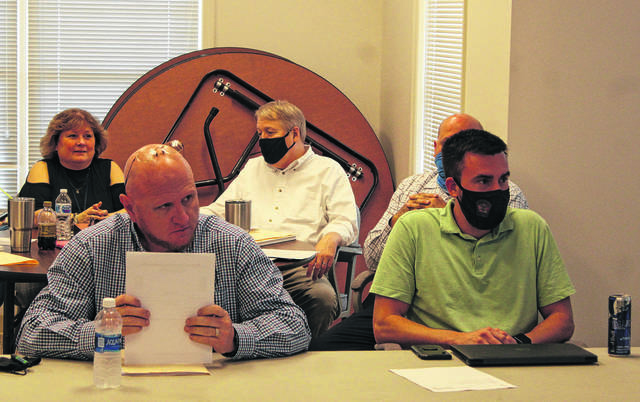 
			
				                                Daily Journal file photo
                                Board of Commissioners Chair Jeff Smart, left, and Vice Chair Justin Dawkins sit with the other board members prior to the closed session meeting on March 25 during which they discussed the tolling agreement.
 
			
		