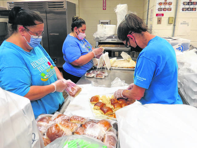 
			
				                                Richmond County Schools cafeteria staff prepare meals for the county’s children.
 
			
		