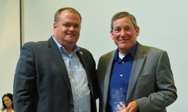 128334620_web1_Jackson-Gulledge-web
Sheriff Mark Gulledge, left, presents former president of FirstHealth of the Carolinas southern region John Jackson with the Sheriff James Clemmons Distinguished Leader Award.
Gavin Stone | Daily Journal