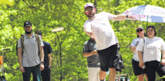 
			
				                                Jake Lucas unleashes his disc on Hole 16 at a fundraiser at Hinson Lake that raised over $1,300 for our local chapter of the Autism Society of North Carolina in April. Over 80 participants signed up to play in the one-round tournament.
 
			
		