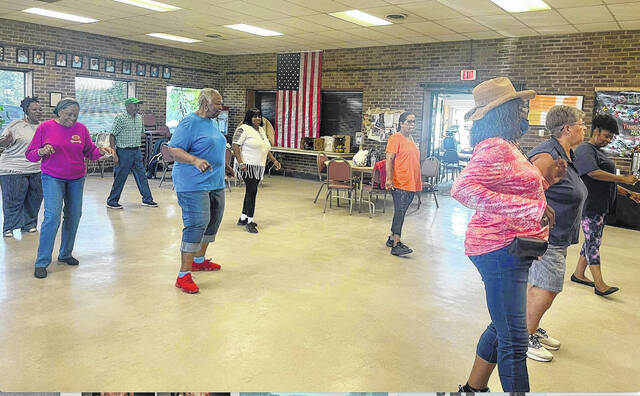 130284498_web1_line-dancing---Copy
Line dancing at the Hamlet Senior Center is one way that some local residents keep moving and grooving.
Contributed photo