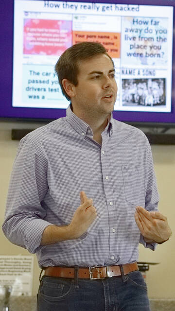 130773071_web1_converted_669b0910080bd
Luke Perrin with the North Carolina Attorney Generals Office discusses online fraud with an audience at the Hamlet Senior Center last Thursday. Scan the QR code for a video from the event.