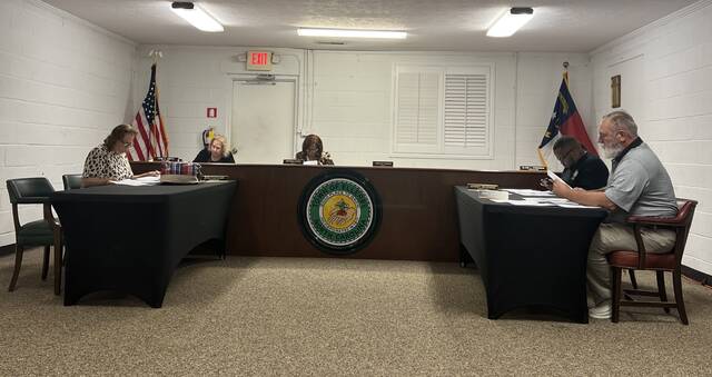 131043600_web1_DJI_20241104_185559_242
Activity Coordinator Jean Fletcher, Town Clerk Jane Smith, Mayor Brenda Capel, Cemetery Invocation Elsie Freeman, Parks & Recreation Jeremy McKenzie and Sheriff Department Liaison John Sears at Ellerbes town hall meeting
Ana Corral | Richmond Daily Journal