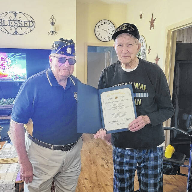 131390096_web1_Post147
Commander Carlton Hawkins presenting Comrade Herman D. Stutts, a Korean War veteran, with a certificate recognizing his 50 years of membership in the American Legion.
Courtesy photo by American Legion Post 147’s Facebook account.