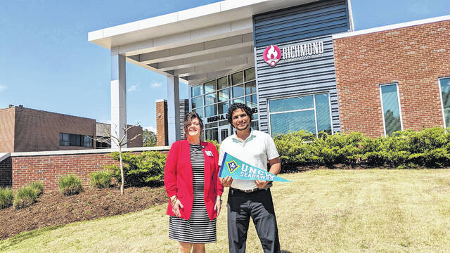 131433081_web1_Human-Services-Grad_UNCW_Assem-Hussien
Human Services Program Coordinator Amanda McKenzie stands with one of her former students, Aussem Hussien, who took her advice and continued his education at the University of North Carolina-Wilmington after earning his associate degree from RichmondCC. (Courtesy photo).